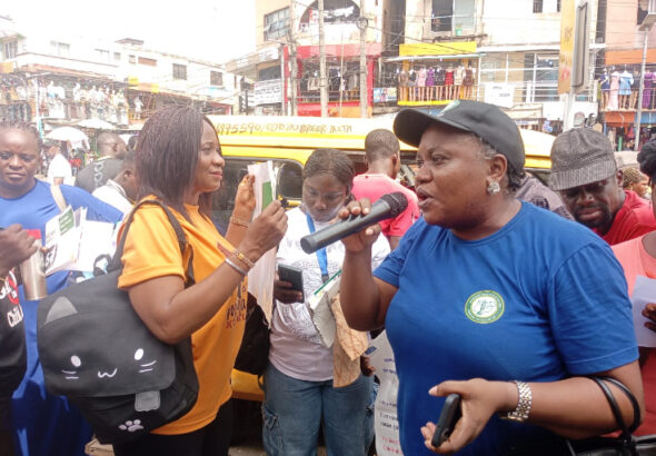 Activists sensitising traders on the Administration of Criminal Justice Law in Ikeja Ipodo Market, on Friday in Lagos/ Photo: Benedicta Bassey