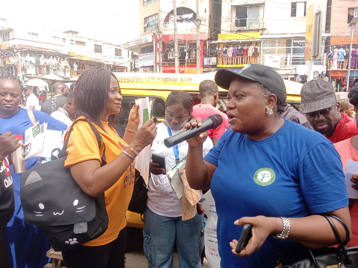 Activists sensitising traders on the Administration of Criminal Justice Law in Ikeja Ipodo Market, on Friday in Lagos/ Photo: Benedicta Bassey